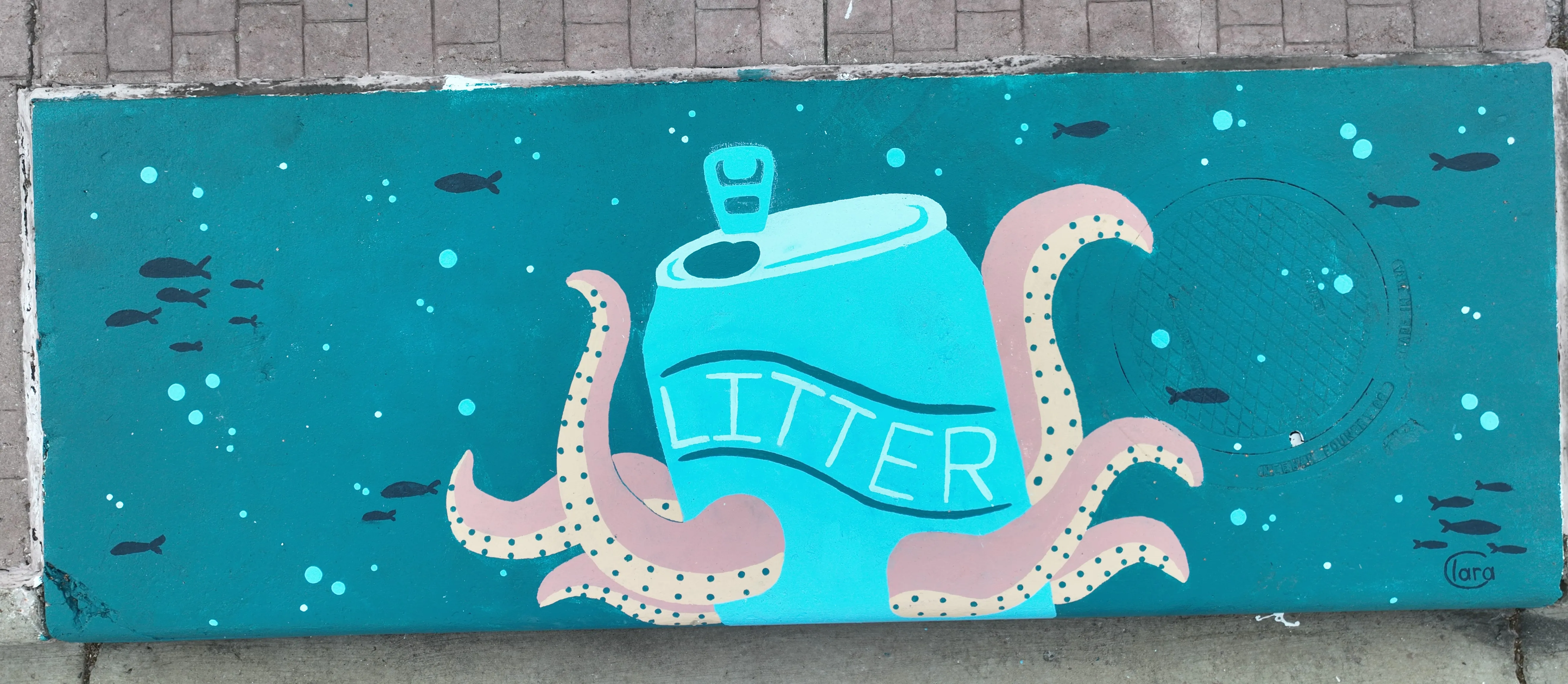A mural on a storm inlet drain featuring a large pop can reading "Litter" with octopus arms extending from the can.