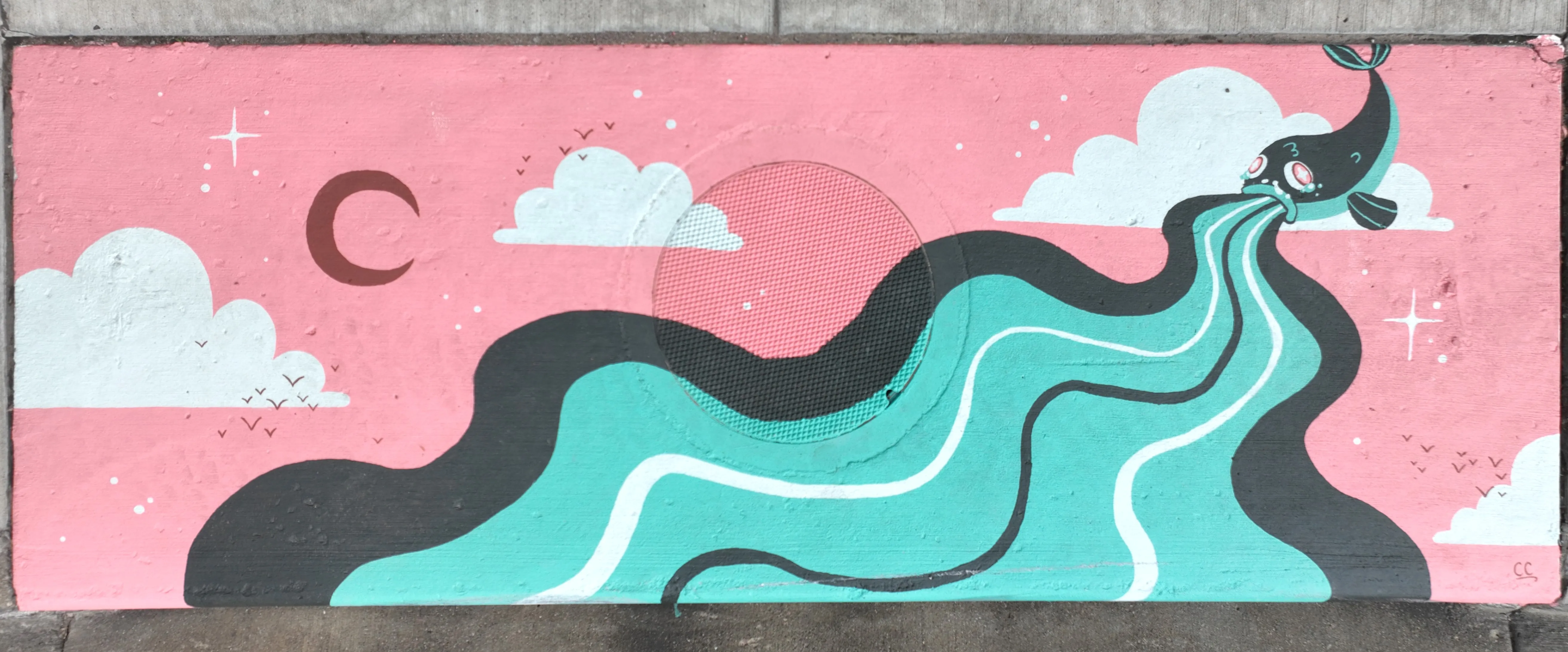 A mural on a storm inlet featuring a pink background with clouds and stars and a blue fish spewing a river-like stream of blue and white color.