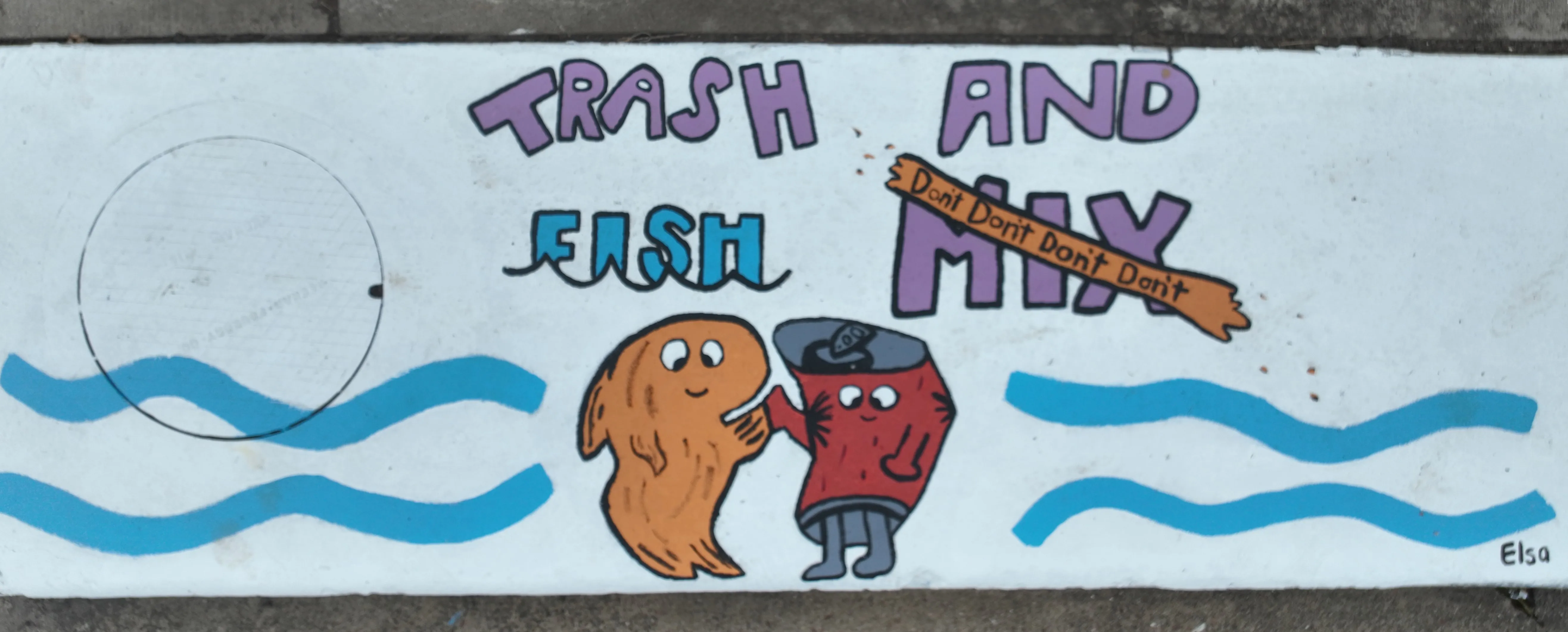 A mural on a storm inlet drain featuring humanlike fish and trash characters high fiving. Text reads "Trash and Fish Don't Mix"