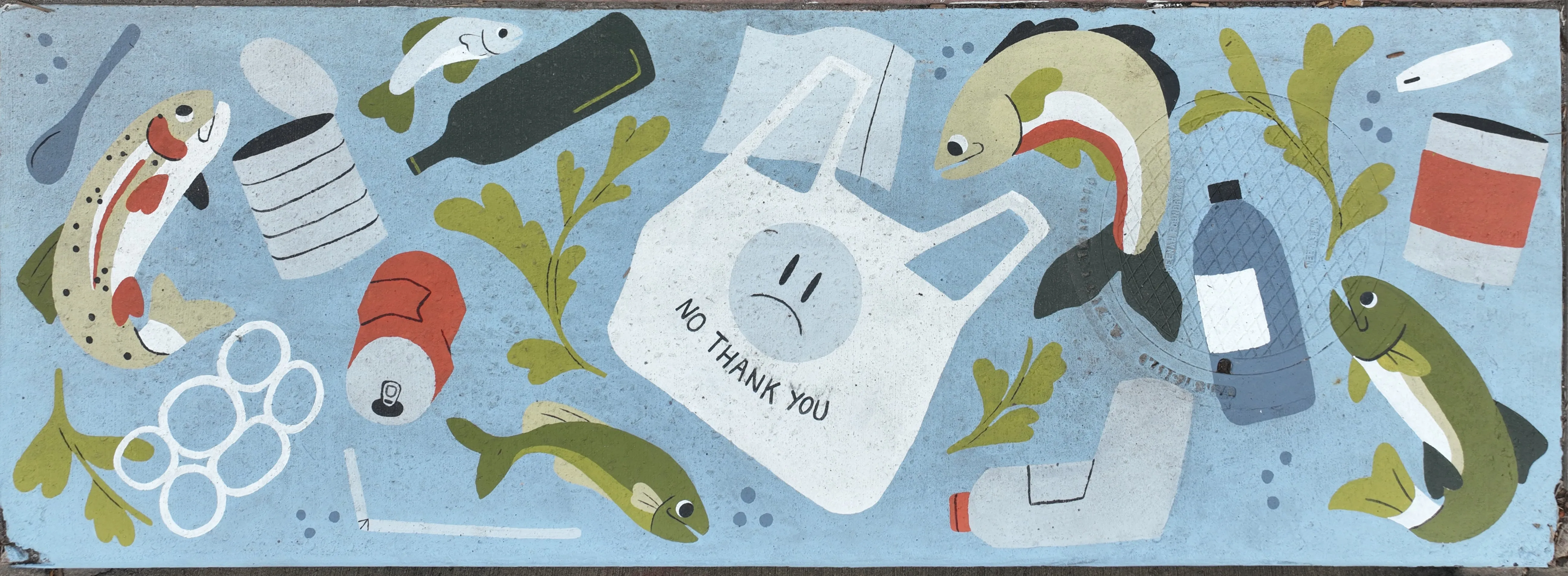 A mural on a stormwater inlet depicting fish swimming among litter. At the center is a plastic bag with a frowning face and text reading "No thank you"